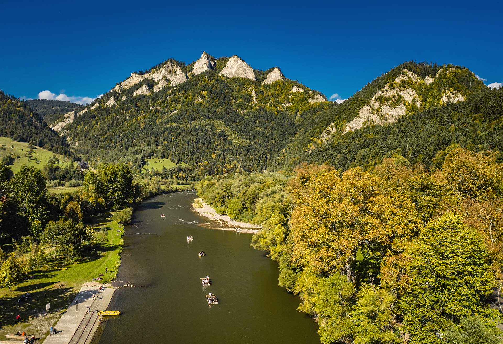 Aerial view of river with mountains in the background in Poland