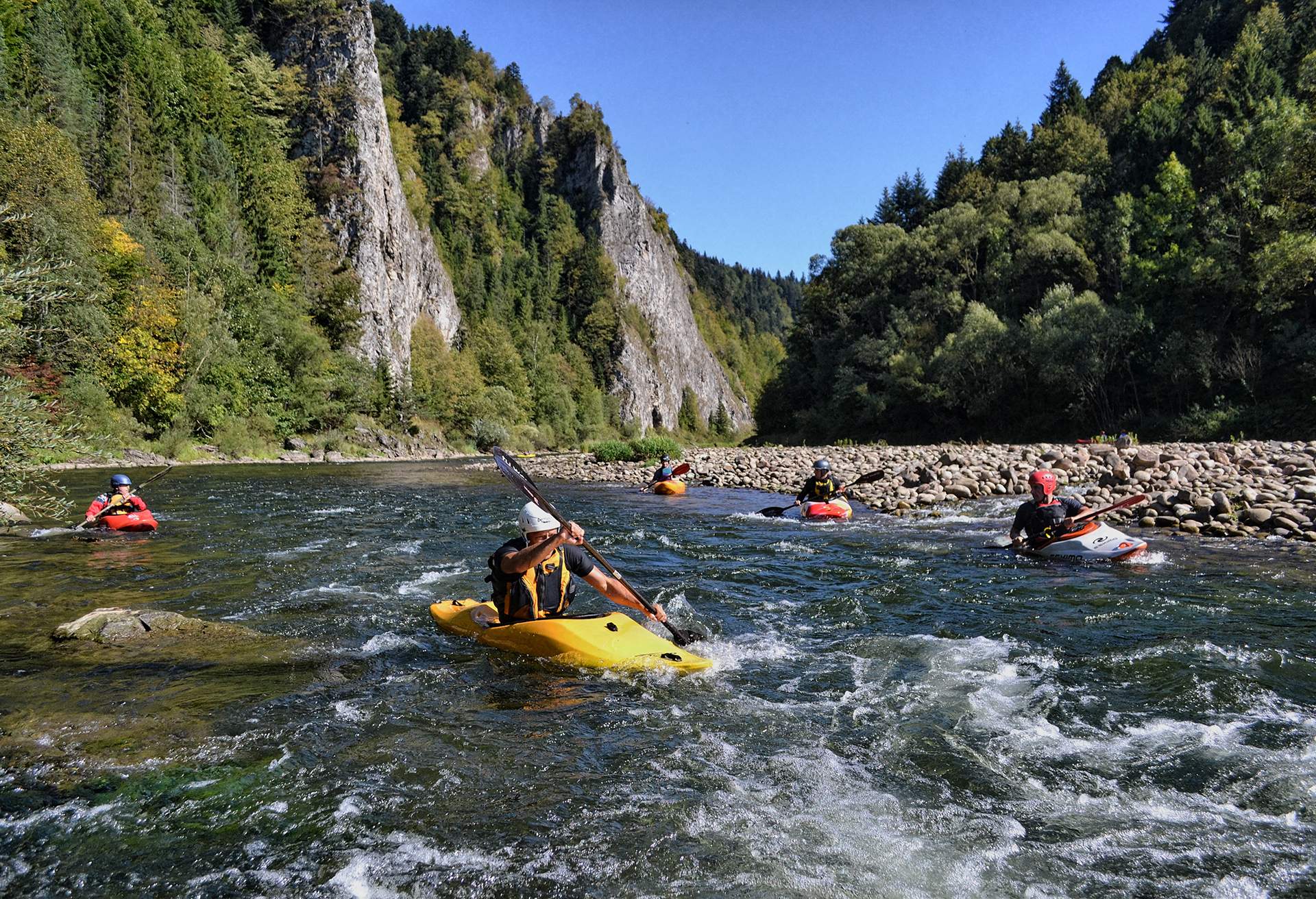 View of people rafting over a river gorge, Poland