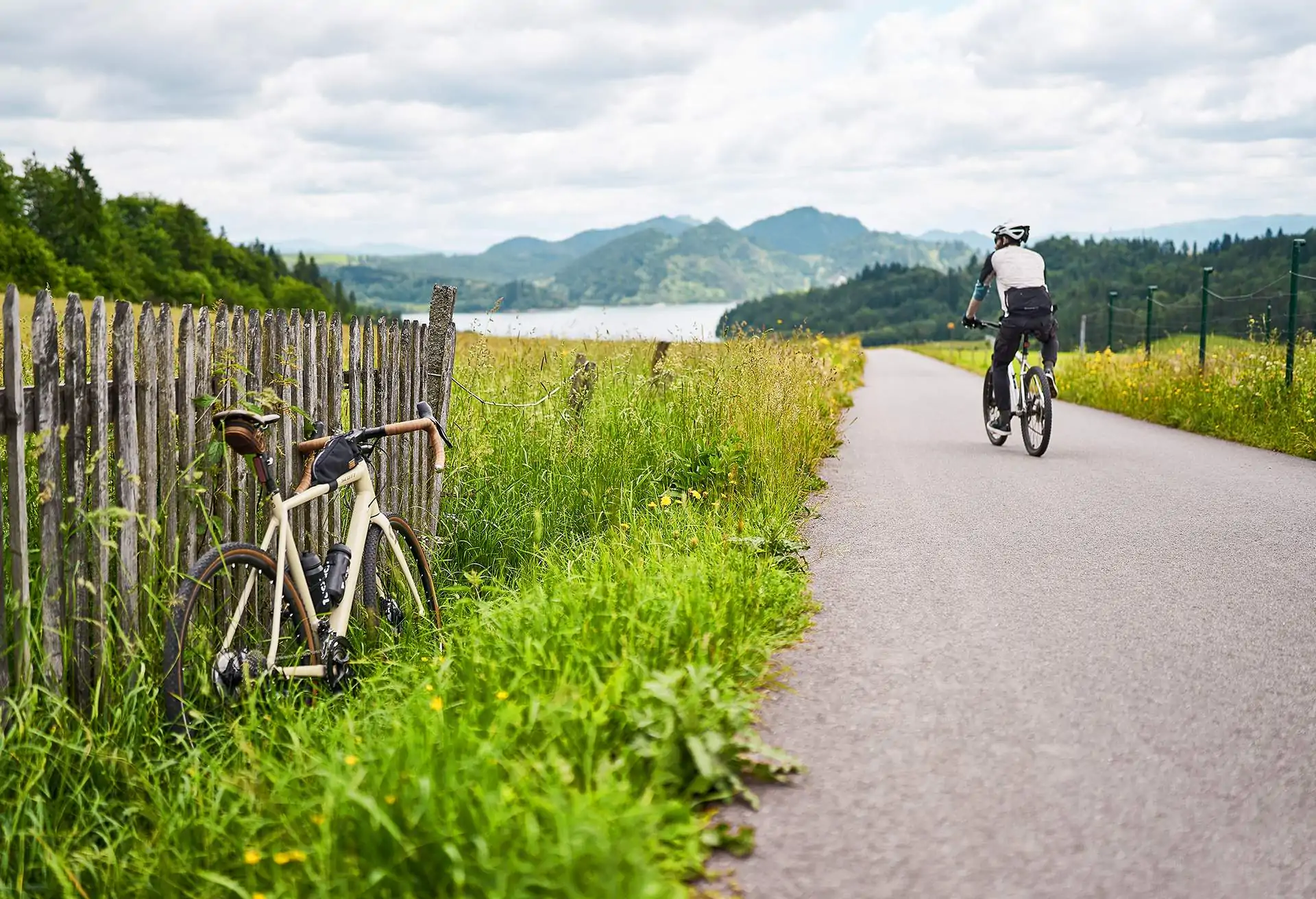 Street view of man cycling in the countryside of Malopolska, Poland